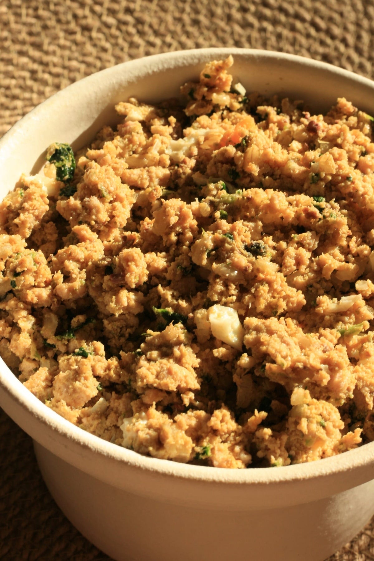 Bowl of Purely Golden Food's Turkey recipe with turkey, spinach and egg visible
